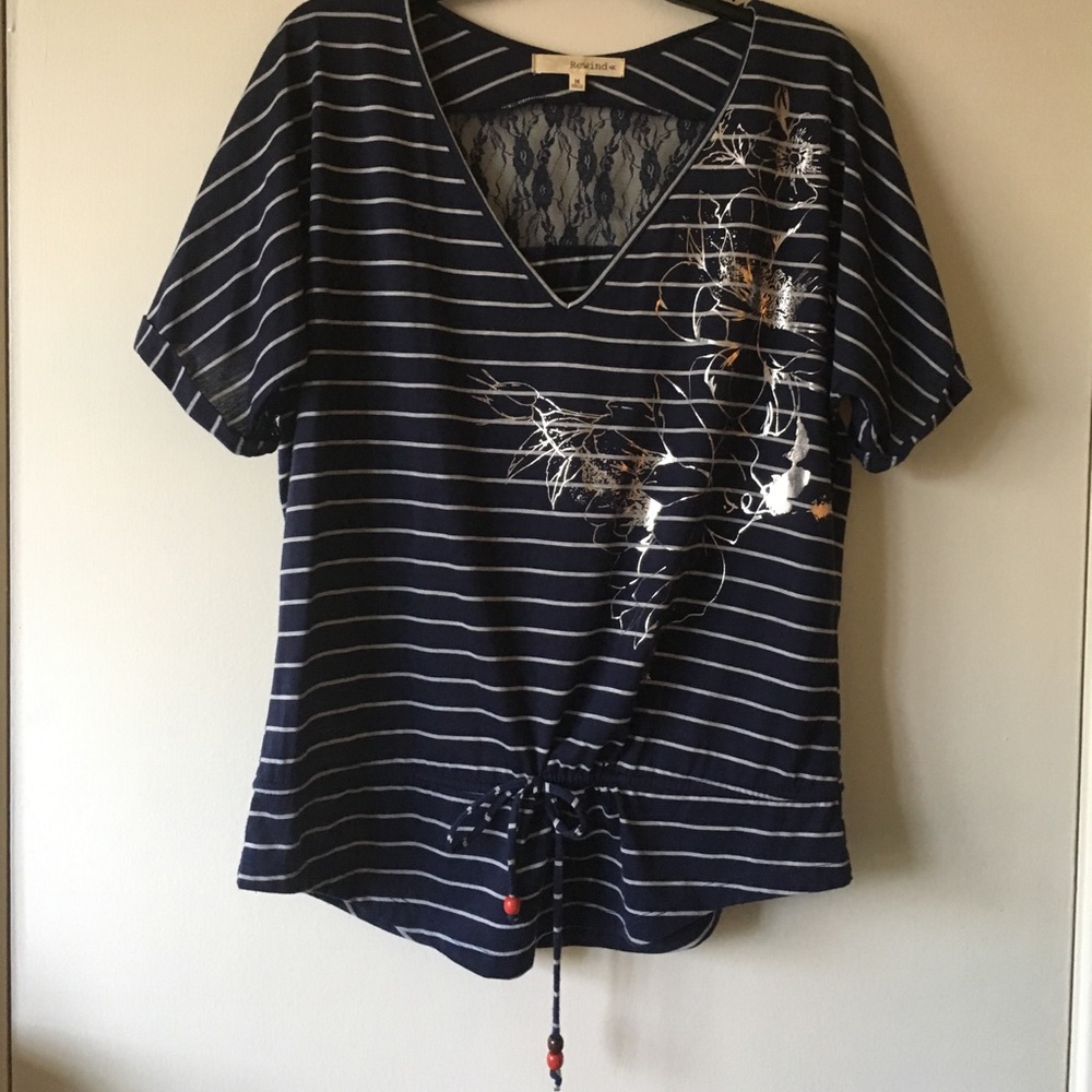 Adorable striped top with lace back.